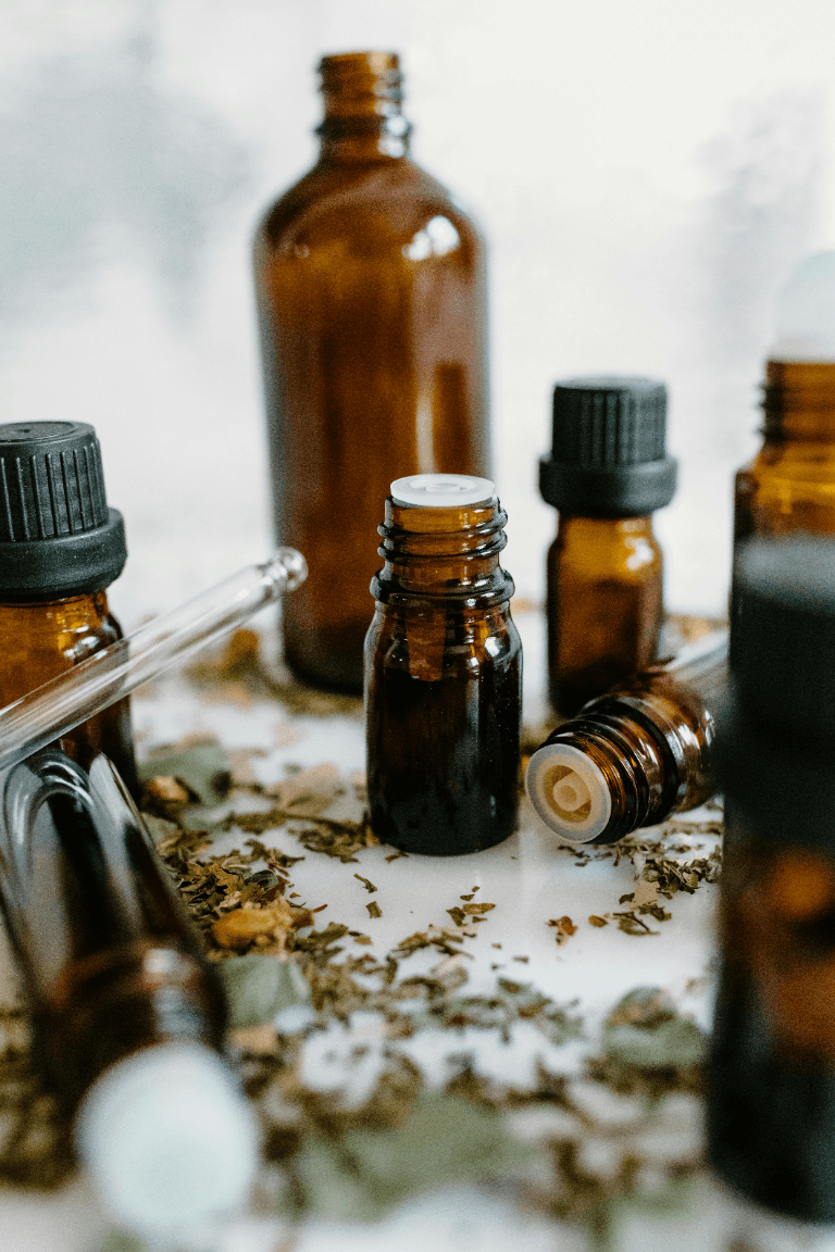 Amber bottles and botanicals used for essential oil evaluation